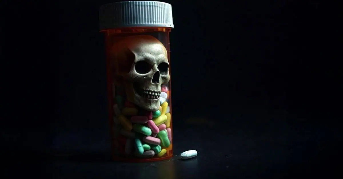 a skull inside a pill bottle